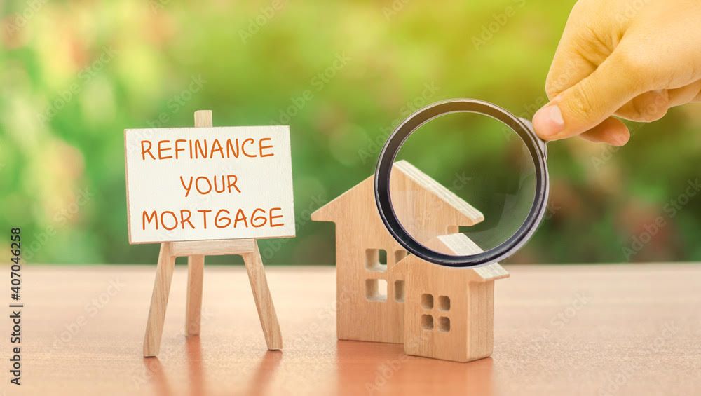 Refinance your mortgage sign with wooden house models