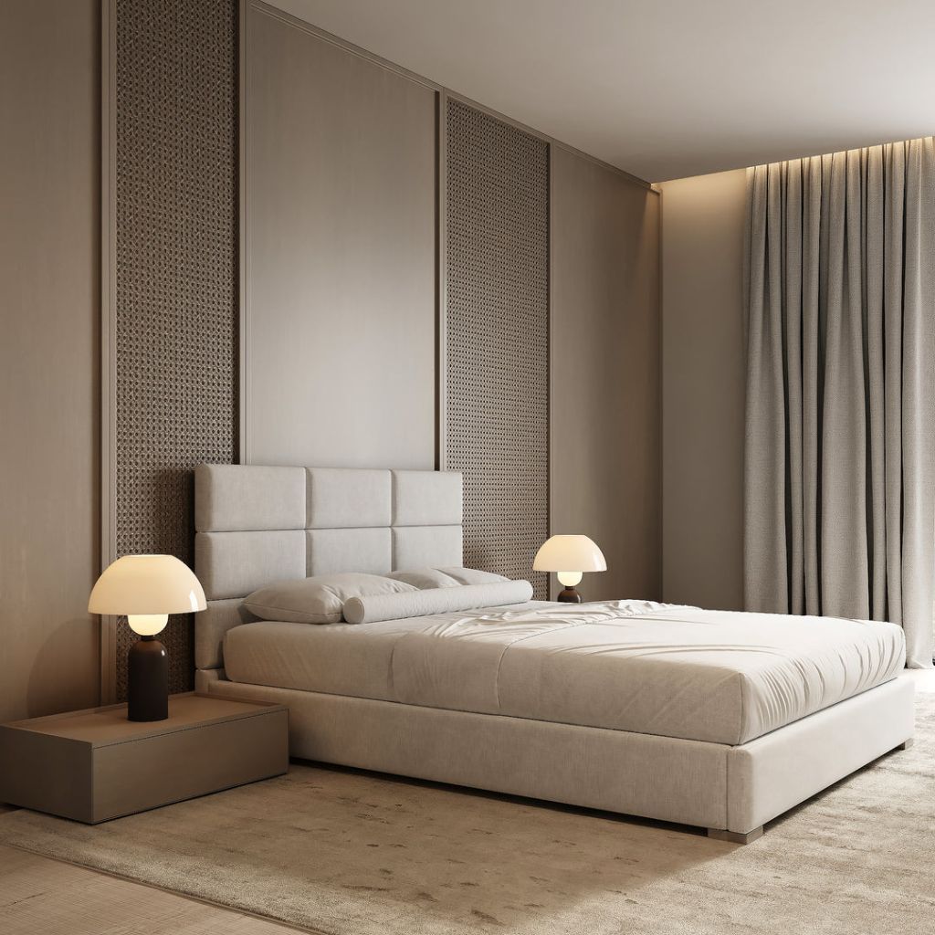 Minimal bedroom with grid-tufted headboard and sculptural bedside lamps