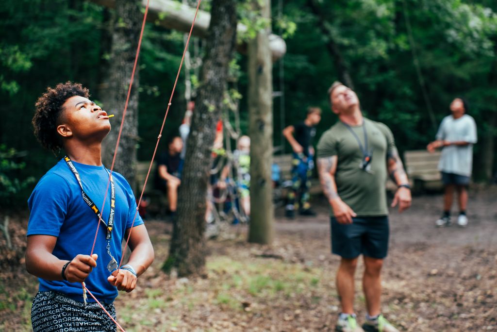 Focused determination in outdoor challenges, representing the mindset needed for successful reentry and personal transformation
