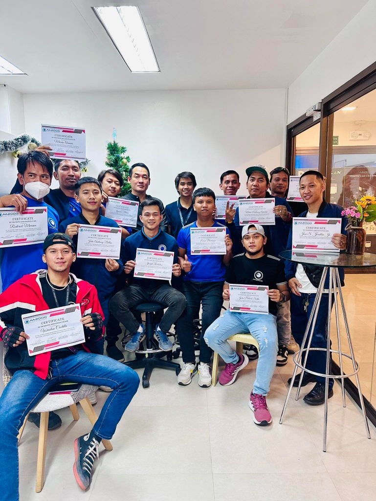 AA2000 certificate ceremony with proud team members holding their achievements
