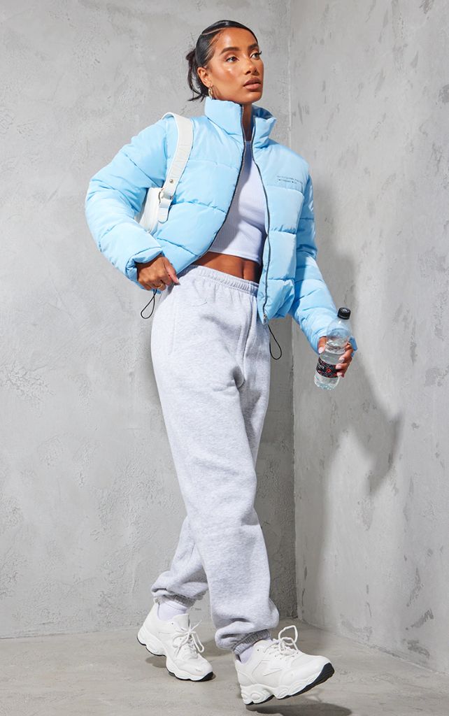 Baby blue cropped puffer with grey joggers athletic outfit