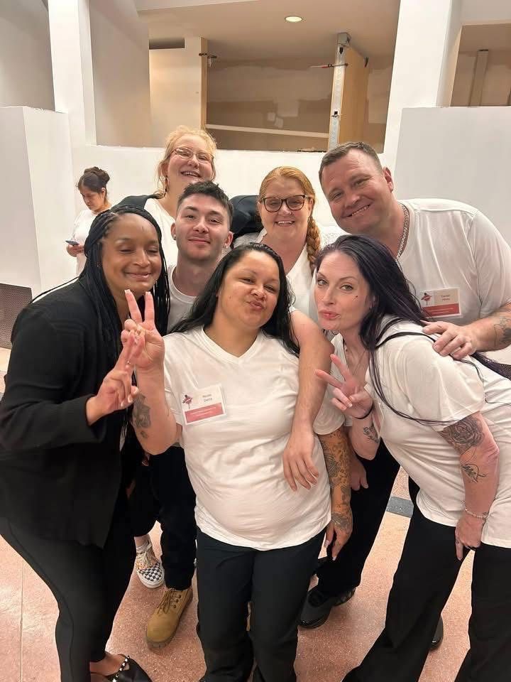 Criminal justice volunteers working together in matching white shirts