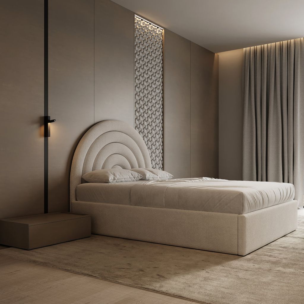 Arched headboard bed highlighted by slender brass sconces