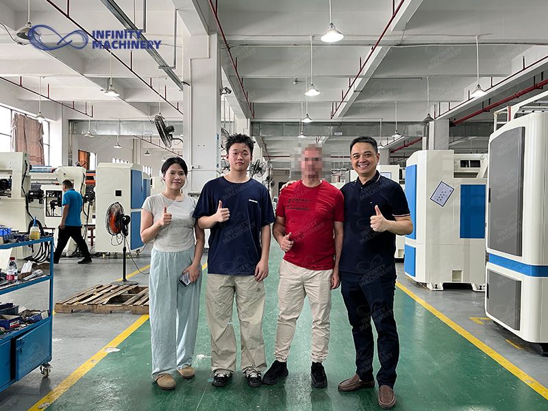 Infinity Machinery factory tour with customers viewing mattress quilting machines and manufacturing equipment