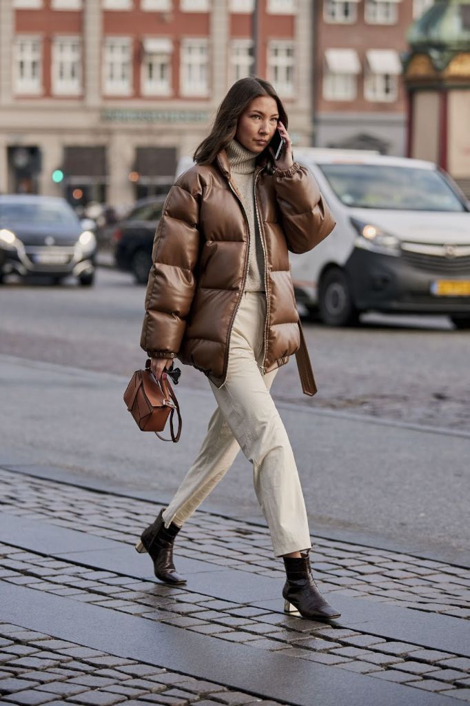 Brown puffer jacket with cream turtleneck tonal outfit