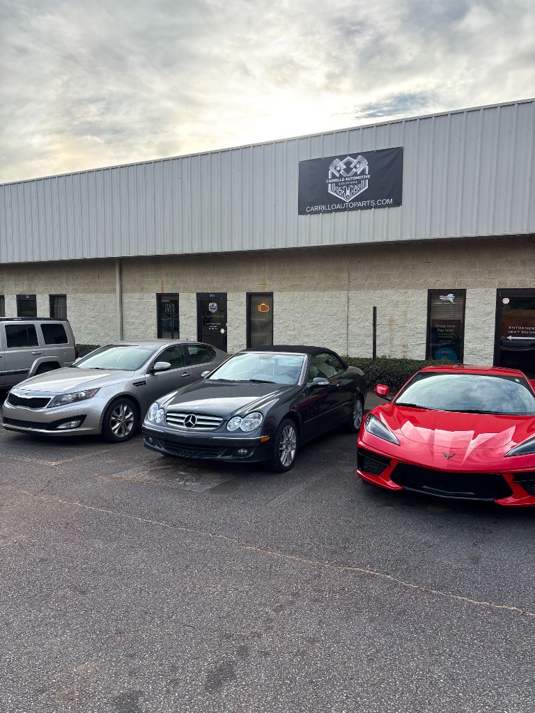 Shop Exterior with Multiple Vehicles