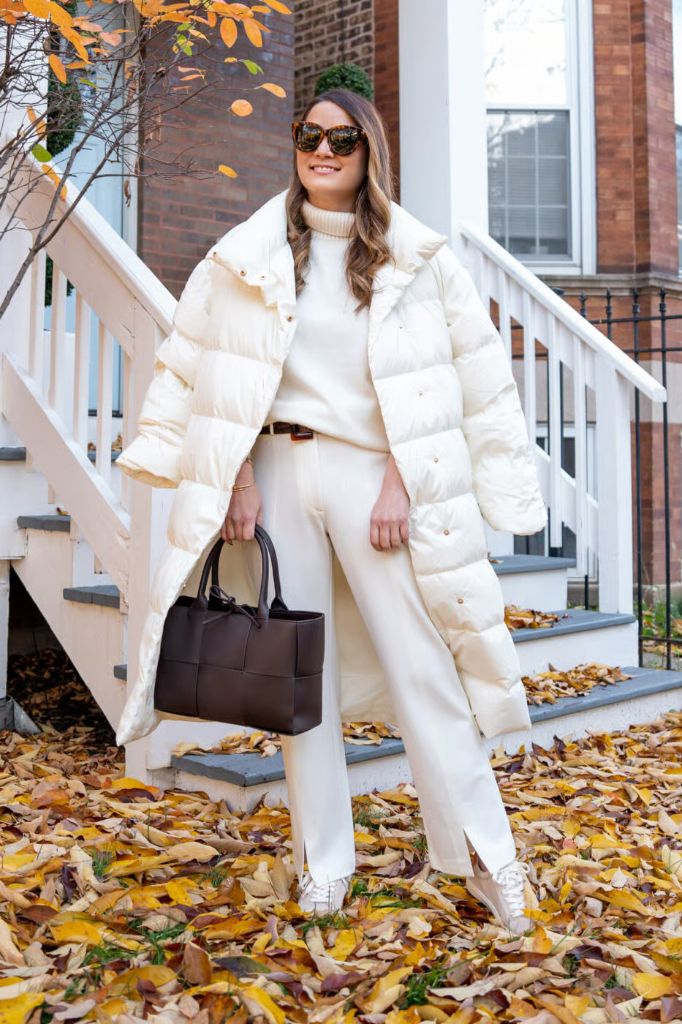 Cream puffer jacket with turtleneck and beige pants winter outfit