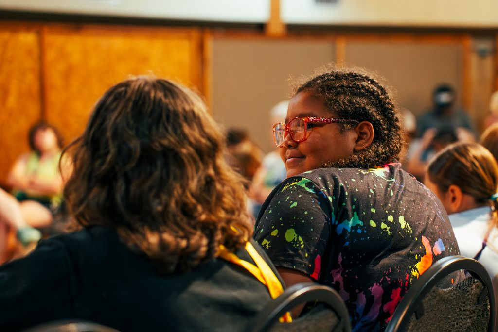 Community gathering and learning environment, showing the supportive atmosphere where transformation and healing take place