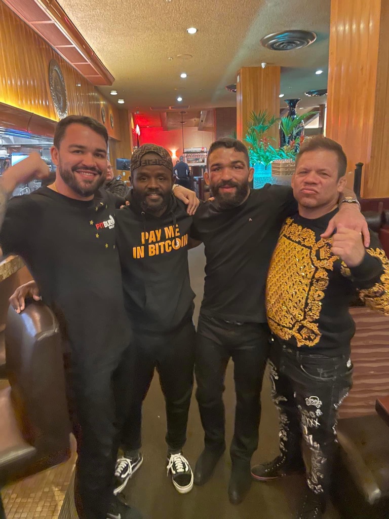 Bitcoin enthusiasts celebrating showing the community aspect of cryptocurrency adoption