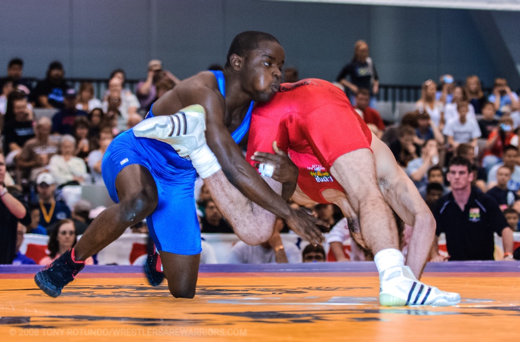 Shawn Bunch executing explosive wrestling takedown technique in competition showing penetration step power