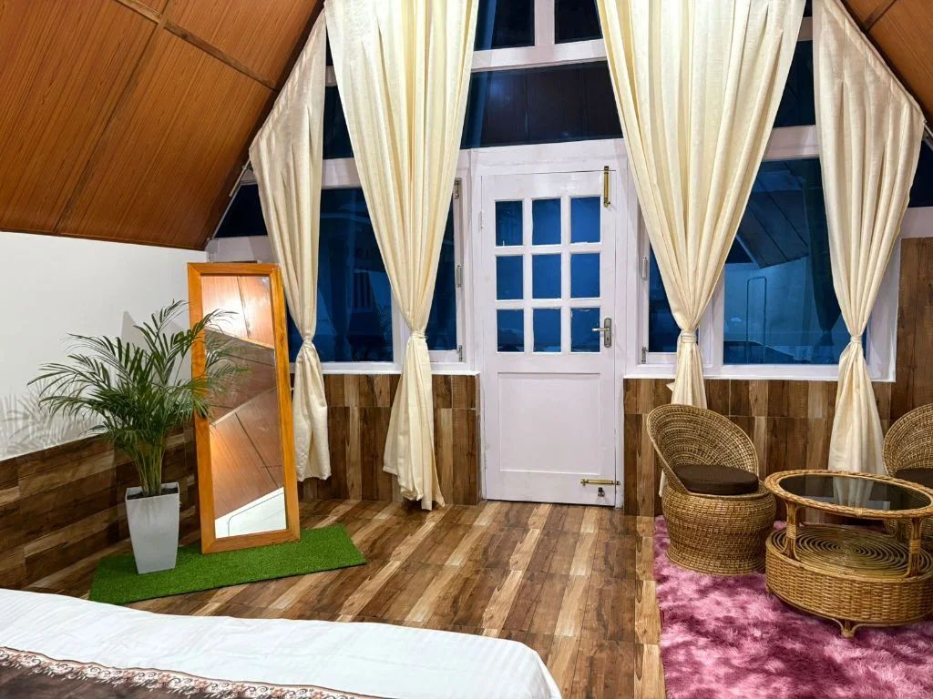 Twin beds room with wooden ceiling and cozy ambiance