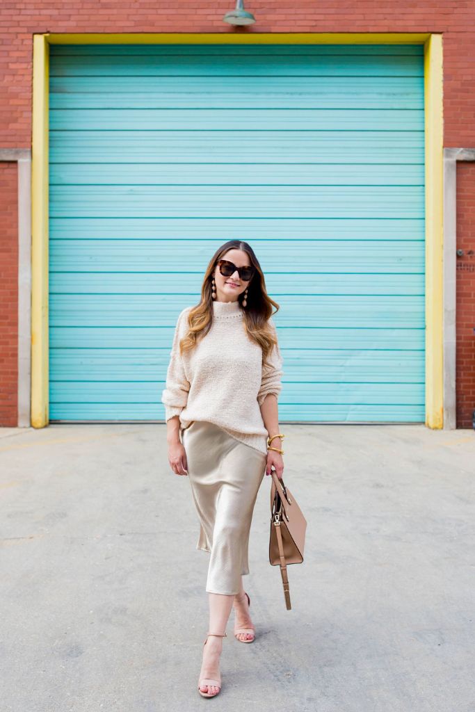 Beige monochrome outfit with satin skirt and heels
