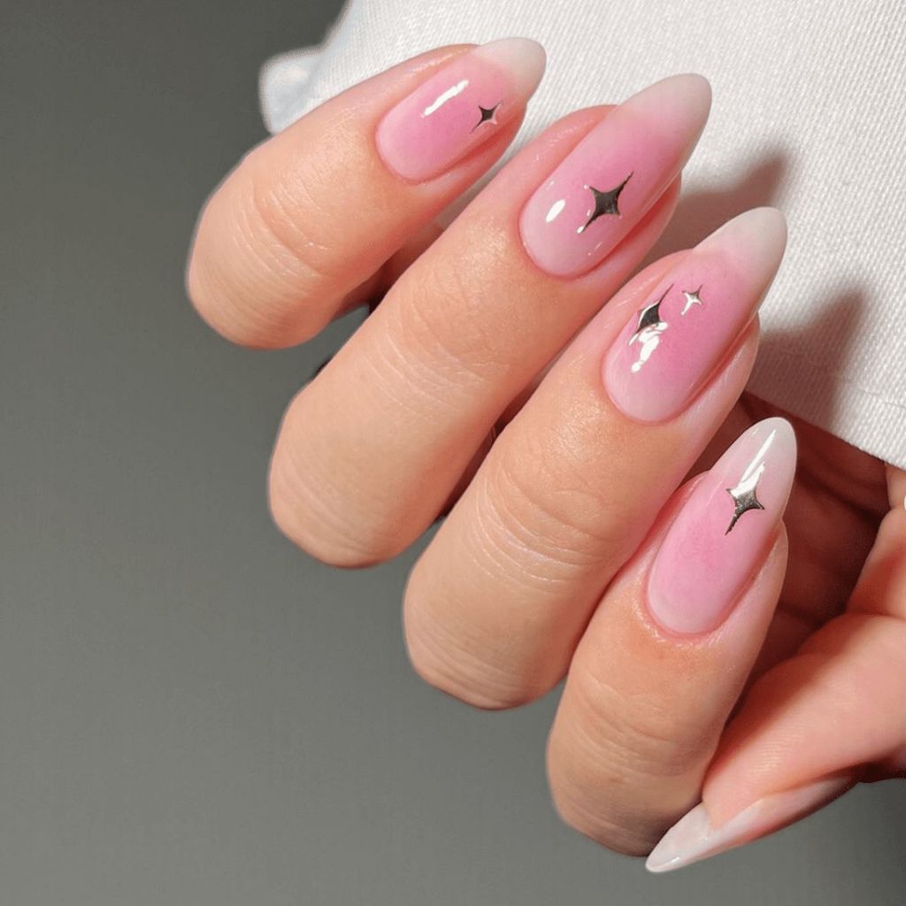 Minimalist pink black star accent Christmas nails