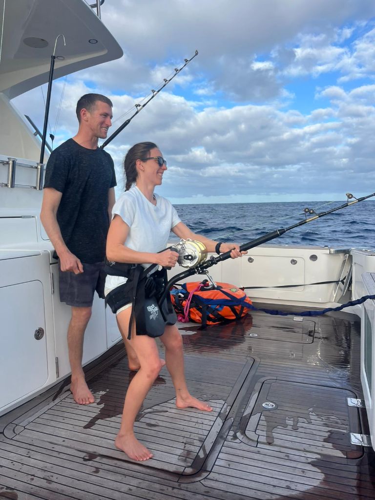 Charter guests fishing at sunset