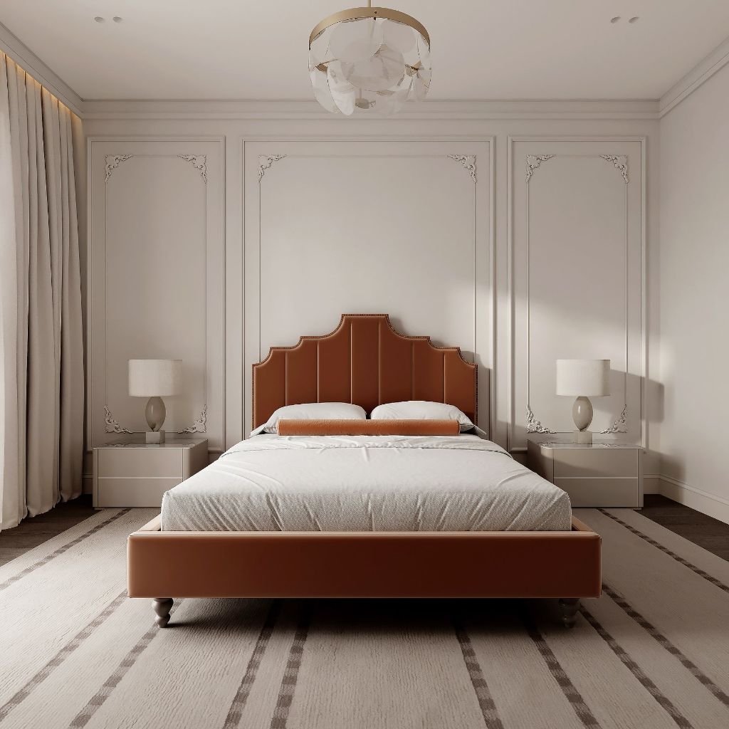 Cognac leather bed centered between classic wall moldings