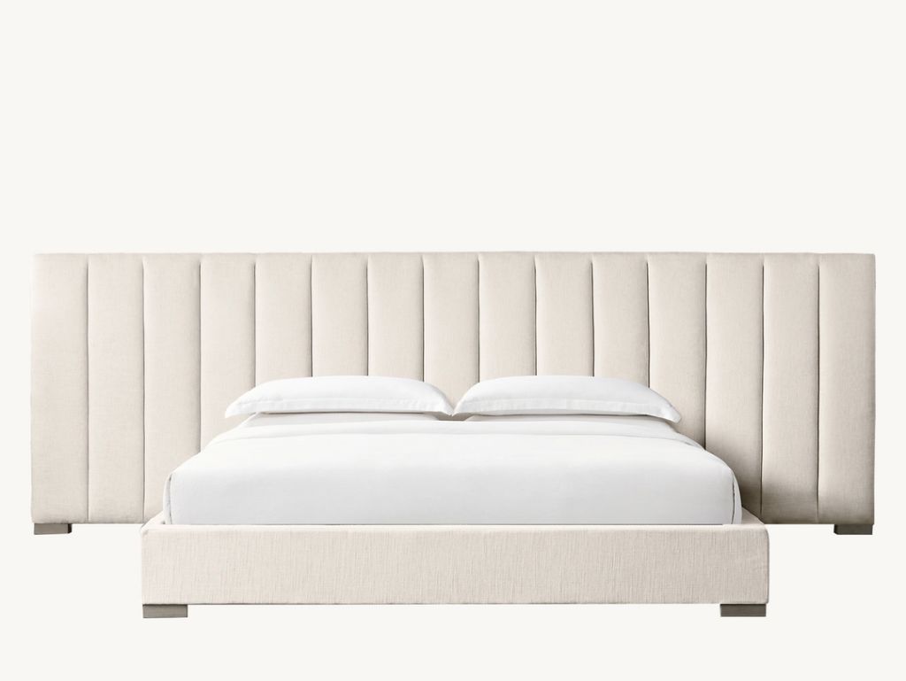 Wide linen-upholstered headboard