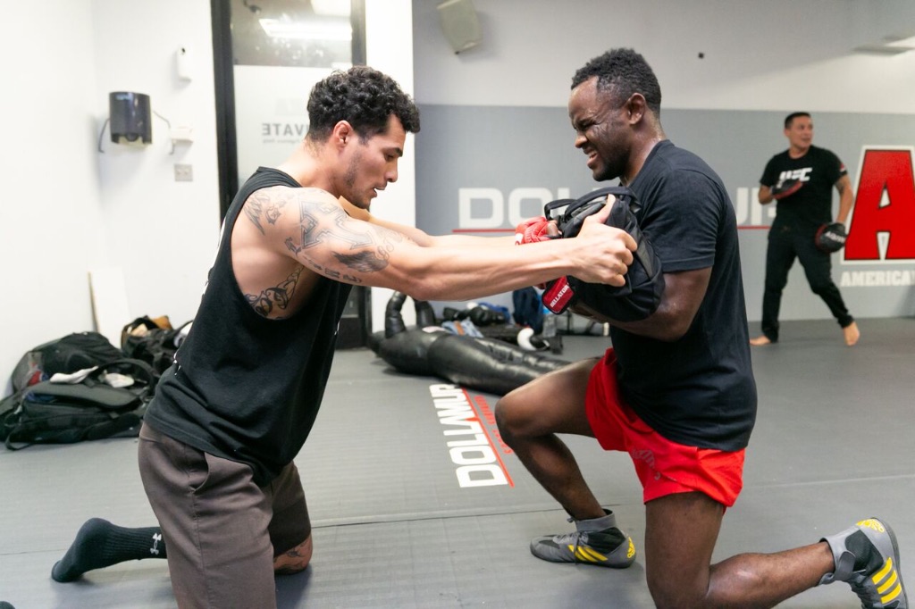 Shawn Bunch training with client demonstrating wrestling technique and coaching methods in gym
