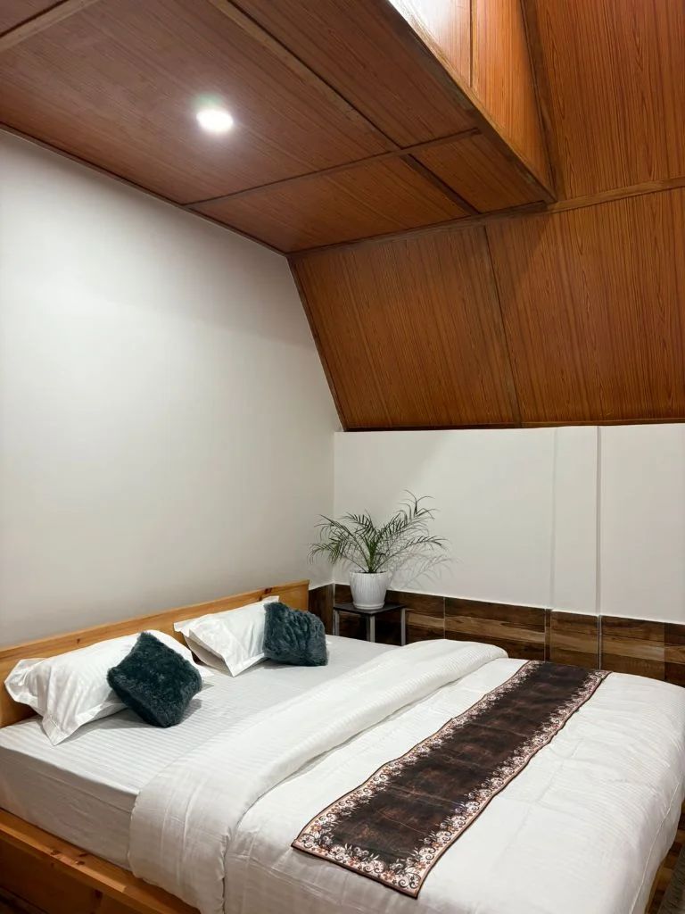 Elegant room with traditional decor and comfortable bedding