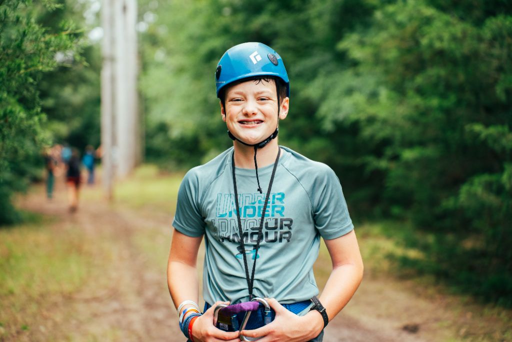 A young person equipped with safety gear, representing preparation and readiness for life's challenges through proper support and mentorship