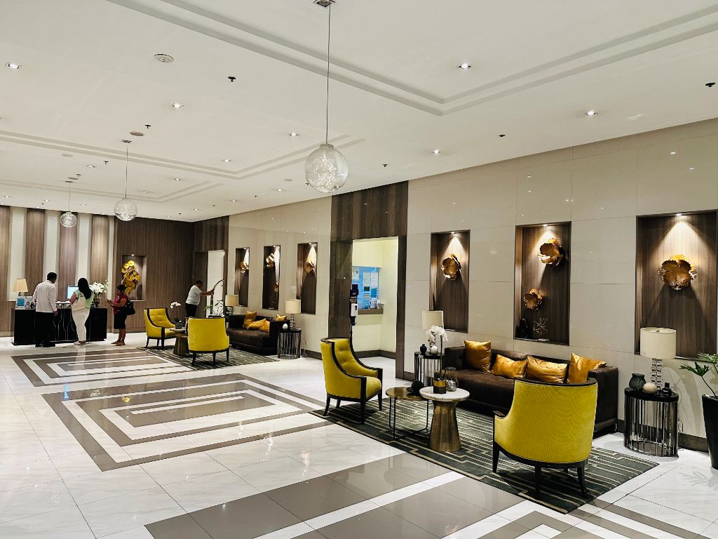 81 Newport Blvd luxury lobby with contemporary design and golden accents