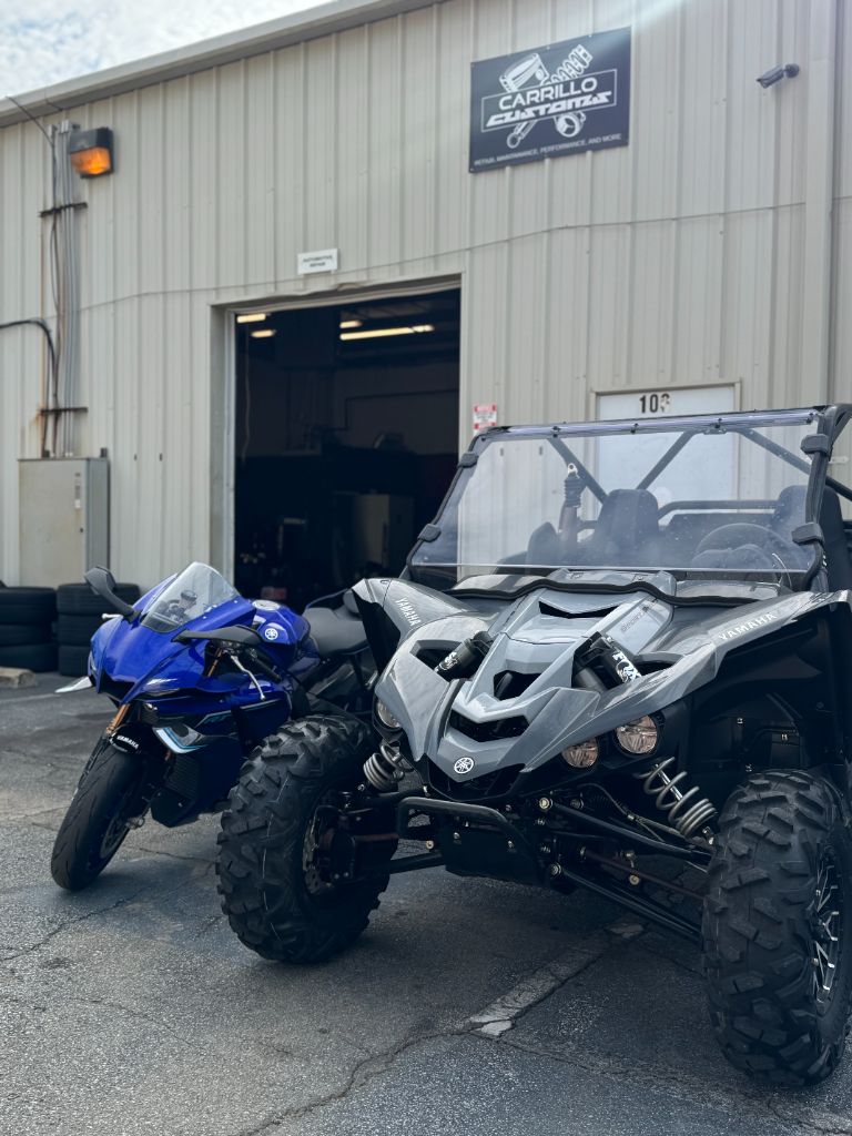 Blue Sport Bike and Yamaha UTV Outside Shop