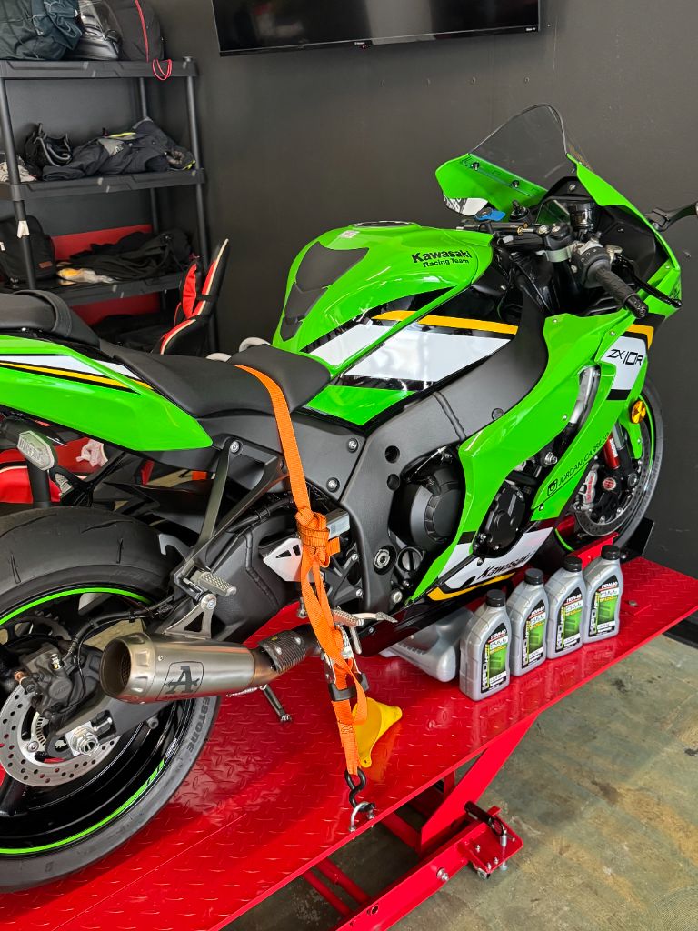 Green Kawasaki ZX-10R Motorcycle on Service Lift