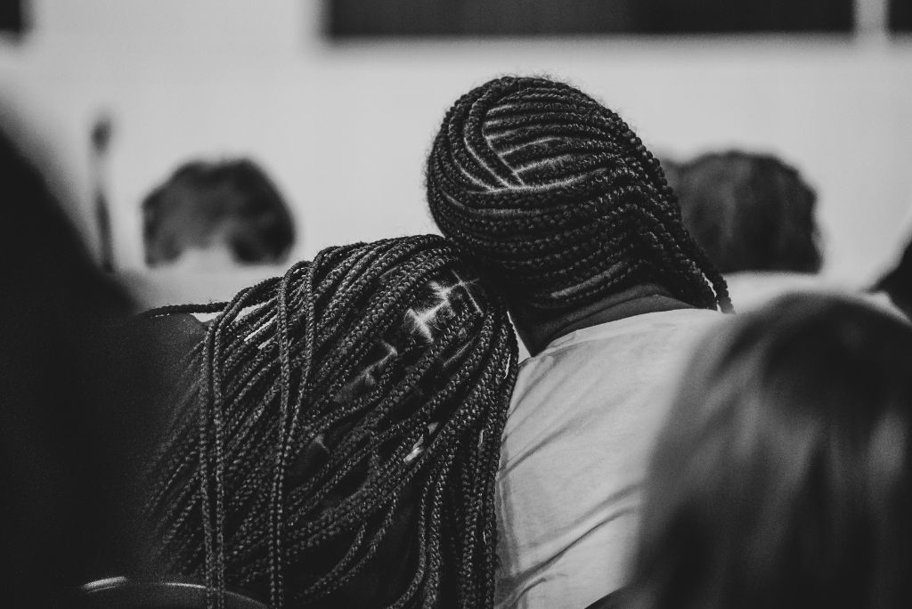 A moment of connection and community support, representing the healing relationships built through CJAMM's programs